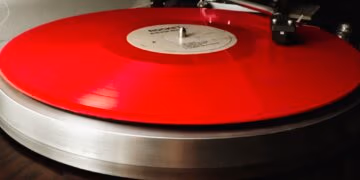 Picture of the album record "R Is For Rocket" by Rocket on a turntable