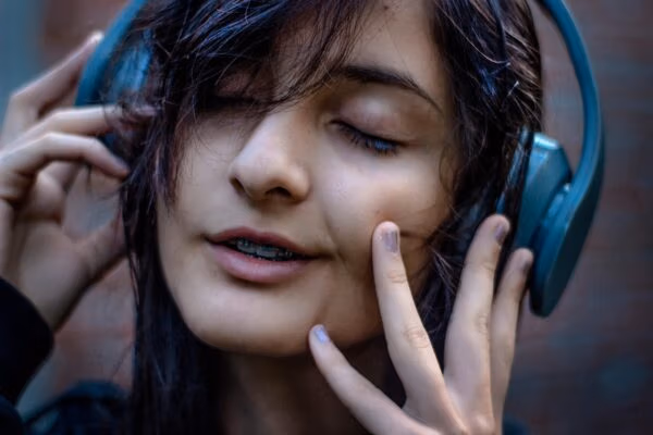 Woman wearing blue headphones