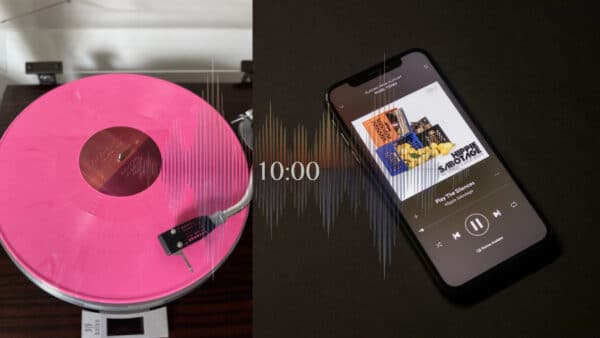 Vinyl album next to an phone playing music superimposed with a waveform and 10:00