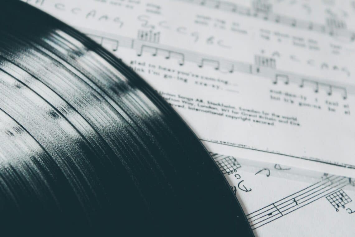 Vinyl album on sheet music
