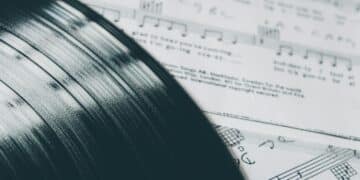 Vinyl album on sheet music