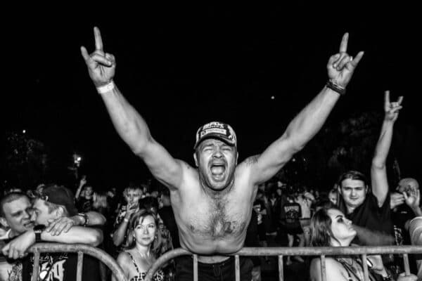 Black & white photo of fan in a rock audience